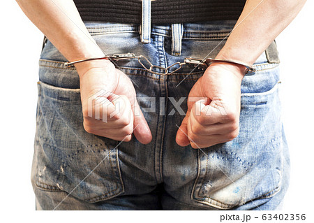 Close up of man in handcuffs arrested isolated on Close up of man in handcuffs arrested isolated on 63402356