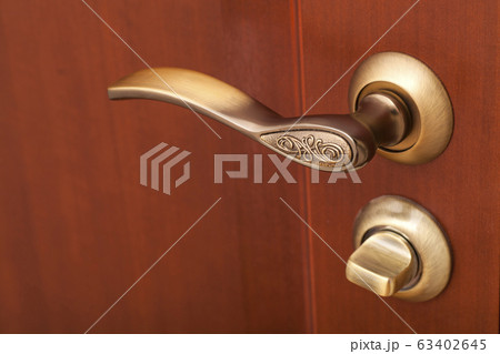 handle and wooden door close up handle and wooden door close up 63402645