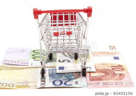 shopping cart on euro banknotes isolated shopping cart on euro banknotes isolated 63403156