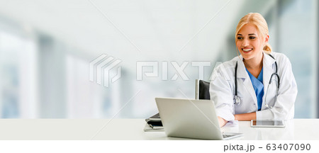 Doctor using laptop computer at the hospital. Doctor using laptop computer at the hospital. 63407090