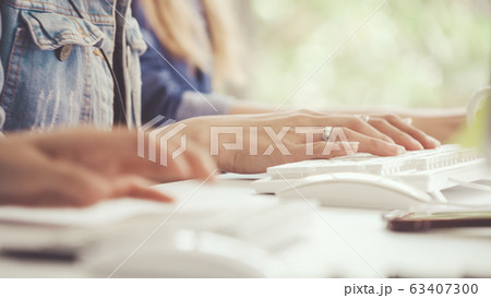 Businesswoman hand typing on computer at desk. 63407300