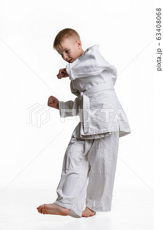 Judo boy practicing to do a sweep 63408068