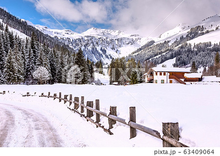 Winter snow village in Austrian Alps, Austria 63409064