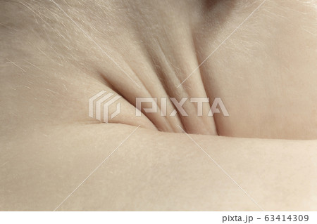 Texture of human skin. Close up of well-kept caucasian human body Texture of human skin. Close up of well-kept caucasian human body 63414309