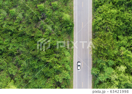 Aerial view of the road passing the forest  with a 63421998