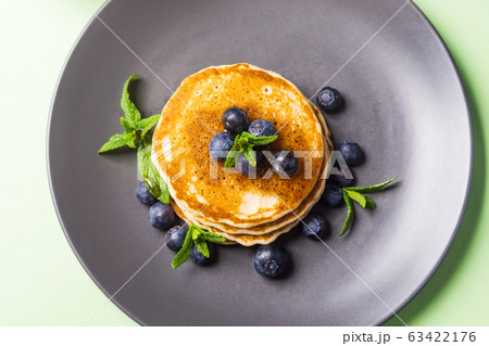 Stack of home made pancakes with fresh berries Stack of home made pancakes with fresh berries 63422176