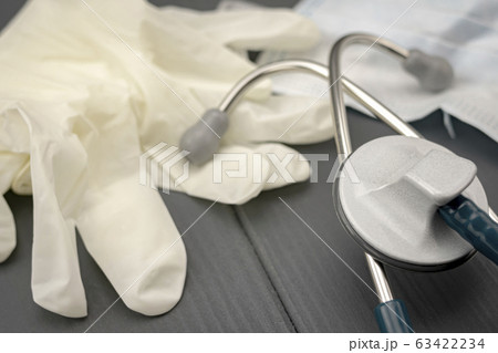 close-up of latex gloves, stethoscope and mask to close-up of latex gloves, stethoscope and mask to 63422234