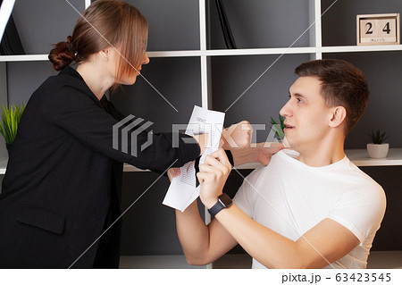 Angry woman has a conflict with the manager of the company 63423545
