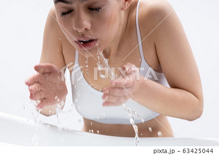 Expressive woman with wet skin shouting stock photo Expressive woman with wet skin shouting stock photo 63425044