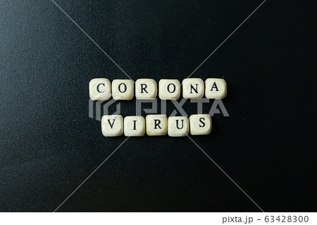 The corona virus  wooden cube  on black background for medical content. 63428300