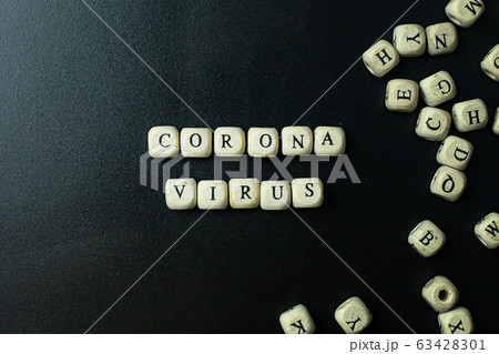 The corona virus  wooden cube  on black background for medical content. 63428301