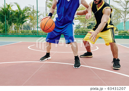 Young men playing basketball Young men playing basketball 63431207
