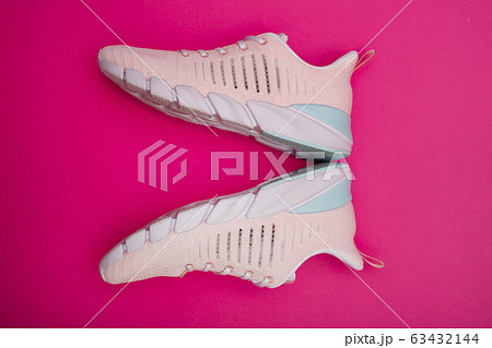 Summer pink Women's sneakers on a pink background Summer pink Women's sneakers on a pink background 63432144