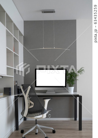 Home working place with modern desk and mock-up computer monitor. 63435259