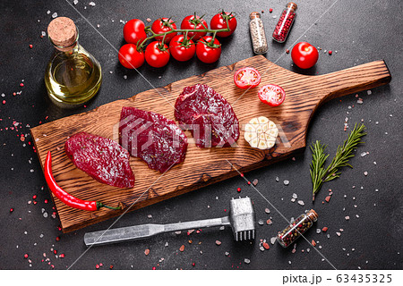 Fresh Raw Beef steak Mignon, with salt Fresh Raw Beef steak Mignon, with salt 63435325