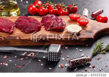 Fresh Raw Beef steak Mignon, with salt Fresh Raw Beef steak Mignon, with salt 63435326