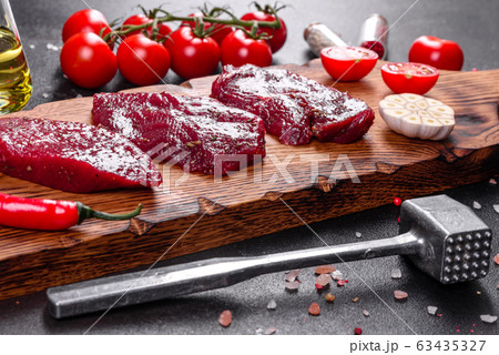 Fresh Raw Beef steak Mignon, with salt Fresh Raw Beef steak Mignon, with salt 63435327