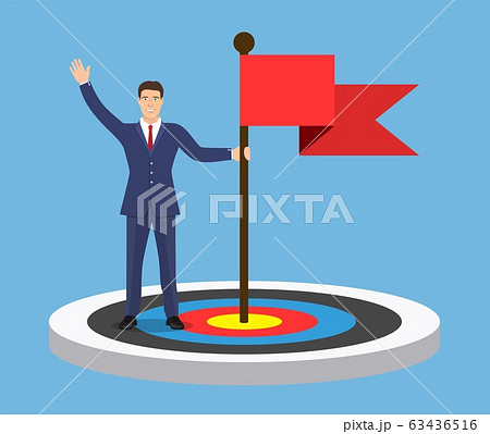 Businessman with flag standing on a target 63436516