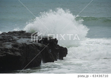 Beach and beautiful views of the cliffs, splashing waves and nature. 63436710