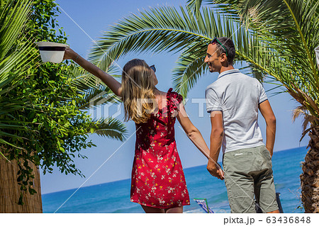 a couple at the beach at holiday a couple at the beach at holiday 63436848