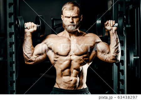 Bodybuilder athletic man workout muscles exercise. Bodybuilder athletic man workout muscles exercise. 63438297