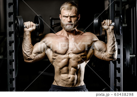 Bodybuilder athletic man workout muscles exercise. Bodybuilder athletic man workout muscles exercise. 63438298