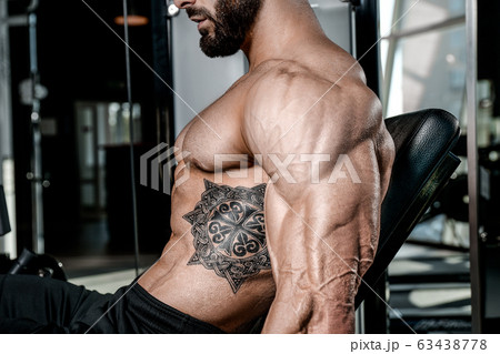 Bodybuilder athletic man workout muscles exercise. 63438778