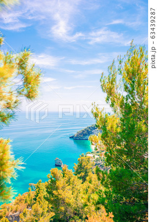 Beautiful cozy bay with boats and clear turquoise water in Italy Beautiful cozy bay with boats and clear turquoise water in Italy 63439287