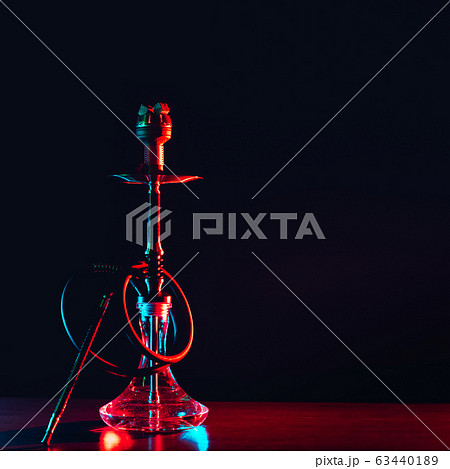 hookah shisha with coals on the table on a black background 63440189