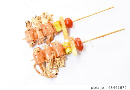 grilled pork bacon rolling needles mushroom with barbecue sauce on white background 63441672