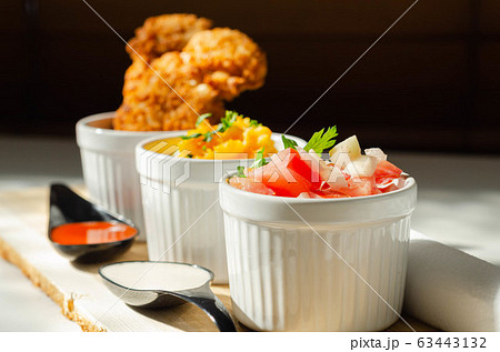 Breaded and herbed chicken breast fillet served 63443132
