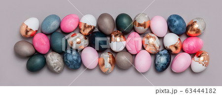 Pattern of pink and blue eggs on a gray background Pattern of pink and blue eggs on a gray background 63444182