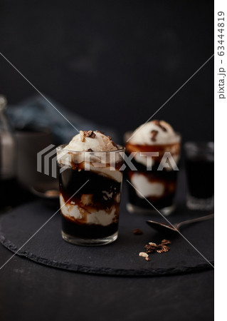 Iced coffee with vanilla ice cream. Iced coffee with vanilla ice cream. 63444819