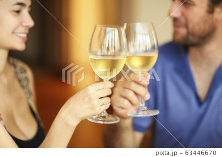 Content couple during dunner in restaurant 63446670