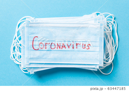 Top view of protective medical masks on blue Top view of protective medical masks on blue 63447185