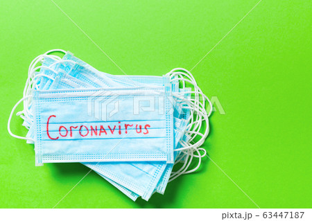 Top view of pile of protective medical masks with Top view of pile of protective medical masks with 63447187