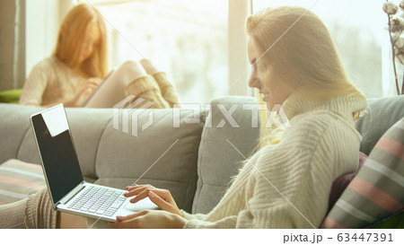 Happy loving family, mother and daughter spending time together at home Happy loving family, mother and daughter spending time together at home 63447391