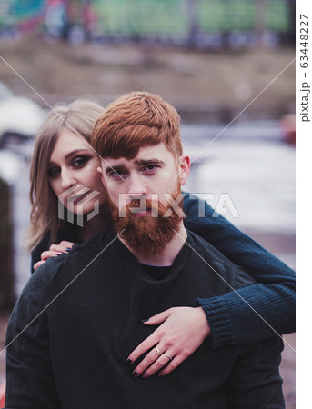woman hugging handsome red head man 63448227
