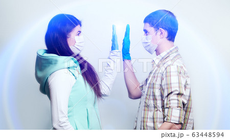 Man and woman in medical mask and medical gloves. Man and woman in medical mask and medical gloves. 63448594