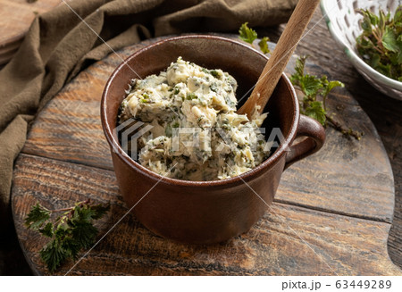 Homemade herbal butter made from young nettles in a jar Homemade herbal butter made from young nettles in a jar 63449289