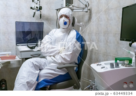 Doctor in protective suit at pandemic period. 63449334