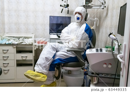 Doctor in protective suit at pandemic period. 63449335