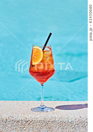 Wine Glass of cold cocktail Aperol spritz against Wine Glass of cold cocktail Aperol spritz against 63450680