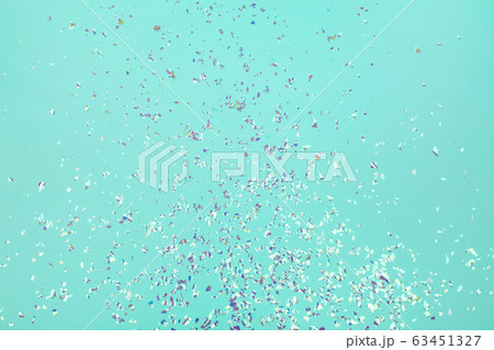 Holographic flying sparkles on blue festive background. 63451327