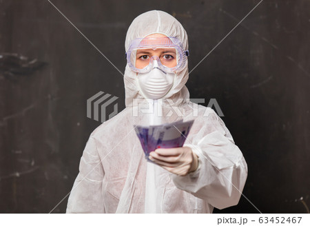 doctor in protection suit and glasses with mask 63452467