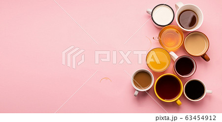 Mugs glasses with various traditional drinks coffee tea juice on pink background. Flat layout top view. Drinks concept. 63454912