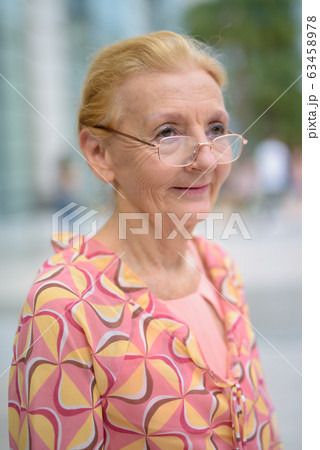 Beautiful senior tourist woman with blond hair relaxing around t Beautiful senior tourist woman with blond hair relaxing around t 63458978