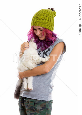Studio shot of happy geek girl smiling while holding cute cat 63459247