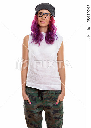Studio shot of young beautiful woman standing and thinking with 63459248