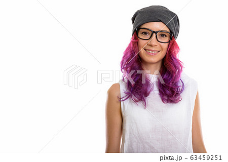 Studio shot of young happy woman smiling while wearing eyeglasse 63459251
